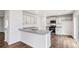 Modern kitchen with granite countertops, stainless steel appliances, and open floor plan at 5449 Baybrook Cir, South Fulton, GA 30349