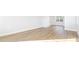 Bright living room with hardwood floors, white walls, and natural light from large windows at 5449 Baybrook Cir, South Fulton, GA 30349
