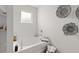 Soaking tub with minimalist decor, including woven baskets and decorative accents for a relaxing ambiance at 5455 Baybrook Cir, South Fulton, GA 30349