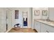 Stylish bathroom showcasing a glass-enclosed shower, towel ladder, granite vanity, and wood-look floors at 5455 Baybrook Cir, South Fulton, GA 30349