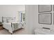 Inviting bedroom with iron frame bed, soft blue accents, decorative pillows, and modern artwork at 5455 Baybrook Cir, South Fulton, GA 30349