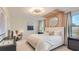 Bright, airy bedroom with modern lighting, neutral tones, and stylish decor at 5455 Baybrook Cir, South Fulton, GA 30349