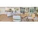 Open-concept dining room featuring stylish furnishings and seamless flow into the kitchen area at 5455 Baybrook Cir, South Fulton, GA 30349