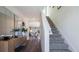 Bright entryway features wood floors, a decorative mirror, and stairs leading to the upper level at 5455 Baybrook Cir, South Fulton, GA 30349