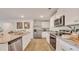 Modern kitchen with white cabinets, granite countertops, and stainless steel appliances at 5455 Baybrook Cir, South Fulton, GA 30349
