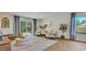 Cozy living room featuring hardwood floors, ample natural light, and access to a private backyard at 5455 Baybrook Cir, South Fulton, GA 30349