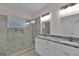 Stylish bathroom featuring double sinks, granite countertops, and a large walk-in shower at 250 Stonecreek Pkwy, Covington, GA 30016
