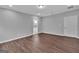 Spacious bedroom features new wood flooring, neutral walls and access to the ensuite bathroom at 250 Stonecreek Pkwy, Covington, GA 30016