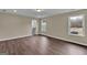 Spacious bedroom features new wood flooring, neutral walls, recessed lighting, and bright windows at 250 Stonecreek Pkwy, Covington, GA 30016
