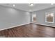 Bright bedroom featuring new wood flooring, neutral walls and a large white baseboard trim at 250 Stonecreek Pkwy, Covington, GA 30016