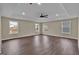 Spacious bedroom with neutral walls, recessed lighting, hardwood floors, and multiple windows at 250 Stonecreek Pkwy, Covington, GA 30016