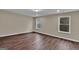 Bright bedroom featuring hardwood floors, recessed lighting, neutral walls and bright, white windows at 250 Stonecreek Pkwy, Covington, GA 30016