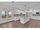 Modern kitchen with white cabinets, granite countertops, stainless steel appliances, and an island at 250 Stonecreek Pkwy, Covington, GA 30016