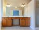Bright bathroom with a double vanity, spacious countertop, and stylish lighting fixtures at 275 Autry Mill Ln, Suwanee, GA 30024