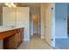 Bathroom featuring tile flooring, single vanity, and open doorway to another room at 275 Autry Mill Ln, Suwanee, GA 30024