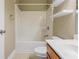 Full bathroom with tub and shower combination, floating shelves, and a single sink vanity at 275 Autry Mill Ln, Suwanee, GA 30024