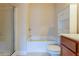 Bathroom showcasing a glass-enclosed tub-shower and vanity with bright cabinets at 275 Autry Mill Ln, Suwanee, GA 30024