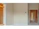 An Empty bedroom with two doors, neutral color walls and carpet flooring at 275 Autry Mill Ln, Suwanee, GA 30024