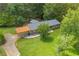 Aerial view of the house, yard, covered parking and surrounding landscape at 676 Smith Store Rd, Covington, GA 30016