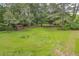 A sprawling backyard showcasing lush greenery and mature trees at 676 Smith Store Rd, Covington, GA 30016