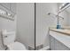 Clean half bathroom featuring a toilet, sink with vanity and storage at 676 Smith Store Rd, Covington, GA 30016