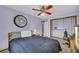 Bedroom with neutral carpet, purple walls, and a ceiling fan at 676 Smith Store Rd, Covington, GA 30016