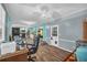 Bonus room with a desk and workstation setup, kitchen access, and a doorway to another room at 676 Smith Store Rd, Covington, GA 30016