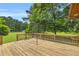 A spacious wooden deck with a metal canopy offering an outdoor living space at 676 Smith Store Rd, Covington, GA 30016