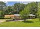 View of home featuring a covered carport, new roof, and nicely manicured lawn at 676 Smith Store Rd, Covington, GA 30016