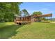 View of the home's wooden deck and car port at 676 Smith Store Rd, Covington, GA 30016