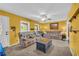Bright living room featuring plush sofas, carpeted floors, and neutral-toned walls at 676 Smith Store Rd, Covington, GA 30016