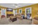 Inviting living room with carpet, large windows and plush seating at 676 Smith Store Rd, Covington, GA 30016