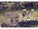 Plat overview highlighting the property's features including a shed, well, and fire pit within the approximate 2.00-acre lot lines at 676 Smith Store Rd, Covington, GA 30016