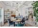 Open dining area with modern decor, connected to kitchen and living spaces at 7530 Springbox Dr, Fairburn, GA 30213