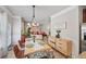 Bright dining area with modern decor, flows into adjacent living space at 7530 Springbox Dr, Fairburn, GA 30213