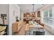 Open dining area featuring natural light and views of the kitchen at 7530 Springbox Dr, Fairburn, GA 30213
