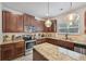 Well-equipped kitchen with granite countertops, stainless steel appliances, and ample cabinetry at 7530 Springbox Dr, Fairburn, GA 30213