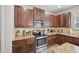 Modern kitchen featuring stainless steel appliances and granite countertops at 7530 Springbox Dr, Fairburn, GA 30213