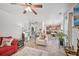 Comfortable living room with herringbone floors and an open layout connecting to the kitchen at 7530 Springbox Dr, Fairburn, GA 30213