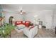 Cozy living room with a fireplace, plush seating, and neutral decor at 7530 Springbox Dr, Fairburn, GA 30213