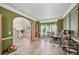 Bright home office with decorative trim, herringbone floors, and a large window at 7530 Springbox Dr, Fairburn, GA 30213