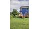Backyard featuring grass, trees, and a blue home at 128 Evergreen Trl # 4, Cartersville, GA 30121