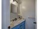 Powder room features blue vanity, marble countertop, and modern lighting at 128 Evergreen Trl # 4, Cartersville, GA 30121