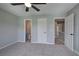 Spacious bedroom with carpet and three doors one to bathroom, closet and hallway at 128 Evergreen Trl # 4, Cartersville, GA 30121