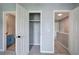 Bedroom with open doors to closet, bathroom, and hallway at 128 Evergreen Trl # 4, Cartersville, GA 30121