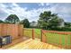 Wooden deck with railing overlooking backyard with trees at 128 Evergreen Trl # 4, Cartersville, GA 30121