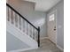 Bright entryway with gray floors, showcasing stairs with a clean, modern design at 128 Evergreen Trl # 4, Cartersville, GA 30121