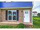 Inviting brick exterior and modern door create an appealing entrance to the property at 128 Evergreen Trl # 4, Cartersville, GA 30121