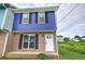 Charming two-story home with brick and blue accents, offering a welcoming curb appeal at 128 Evergreen Trl # 4, Cartersville, GA 30121