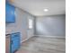 Bright kitchen with stainless steel appliances, and blue cabinets, near door at 128 Evergreen Trl # 4, Cartersville, GA 30121